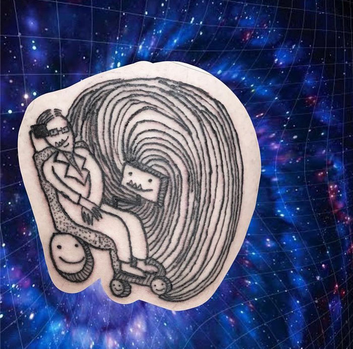 Tattoo with quirky design featuring a unique illustration of a person and abstract shapes against a cosmic background.