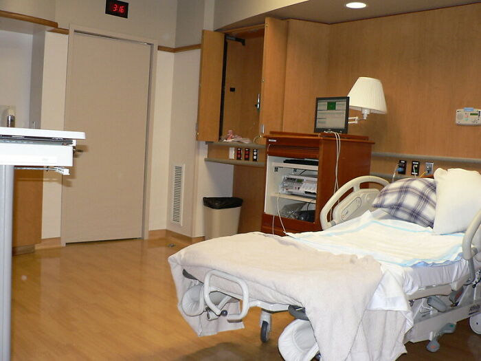 Hospital room with an empty bed and medical equipment, illustrating secrets parents may keep unaware to children.