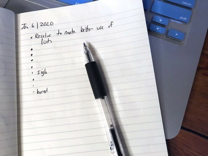 Notebook with handwritten list and a pen on a laptop, symbolizing secrets parents may be oblivious to.