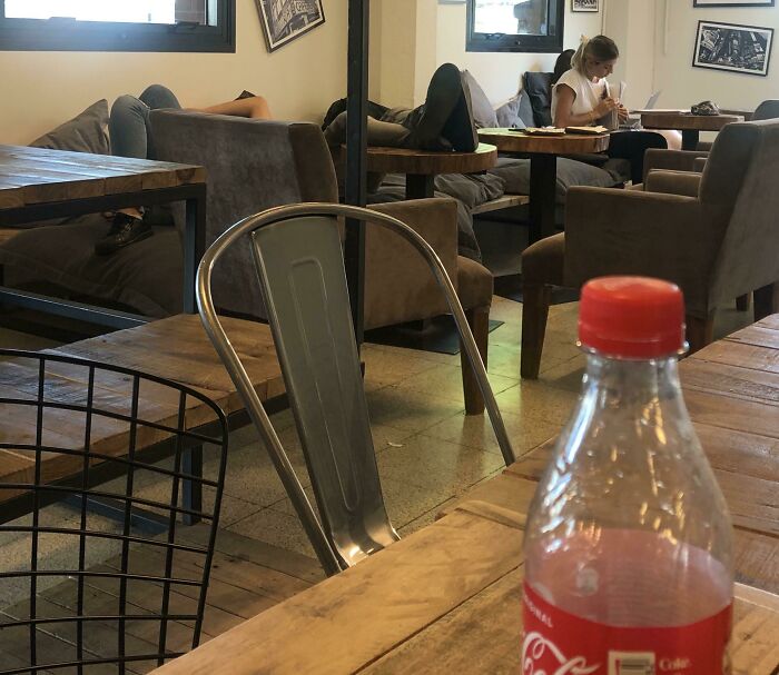 This Guy Putting His Dirty Shoes On Top Of A Restaurant's Table