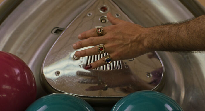 In The Big Lebowski (1998), Jesus Quintana Is Wearing Rings From The American Bowling Congress That Certify His Ability To Roll A Perfect 300 Game, A 299 Game And An Incredibly Difficult 800 Series. Those Rings Tell You That Creep Can Roll