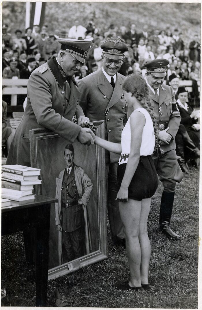 A Dutch Athlete Receives A Portrait Of Adolf Hitler As A Sports Prize, Presented By General Otto Schumann, Commander Of The Ordnungspolizei. The Hague, The Netherlands, 1941