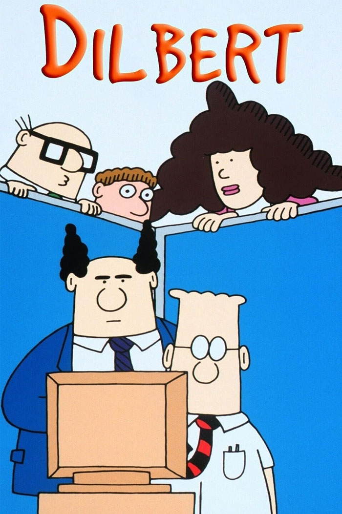 Cartoon characters, Dilbert and colleagues, gather around a computer, showcasing popular ‘90s cartoons.