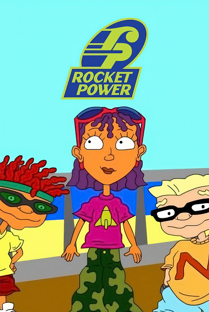 Three '90s cartoon characters from Rocket Power standing together outdoors.
