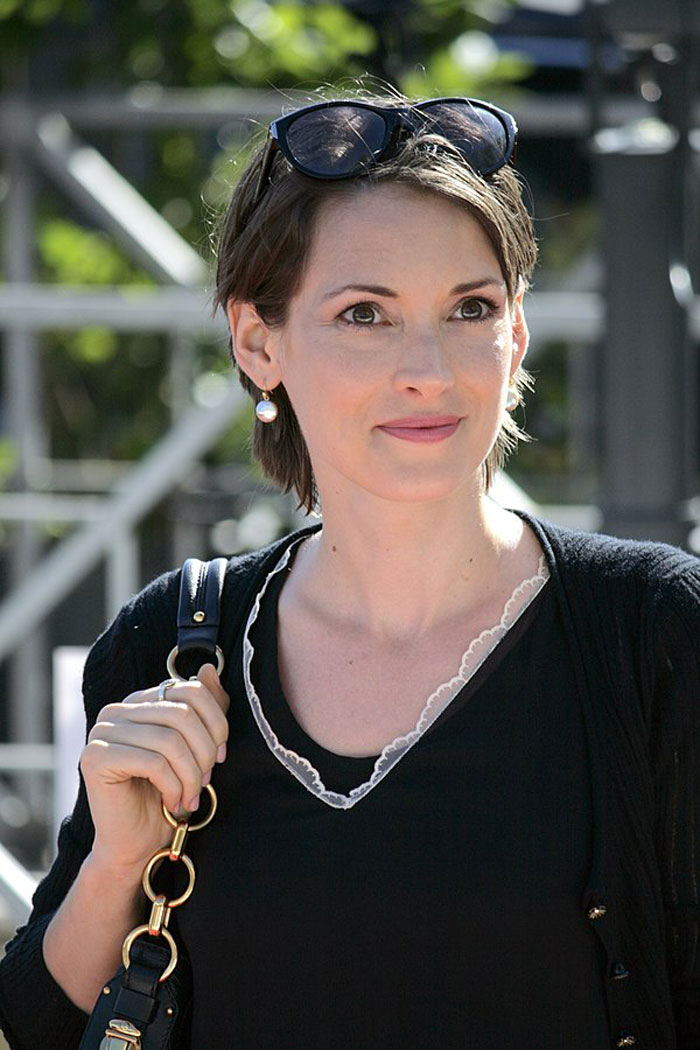Actress wearing black top and sunglasses on head, representing actors who revived their career with a single role.