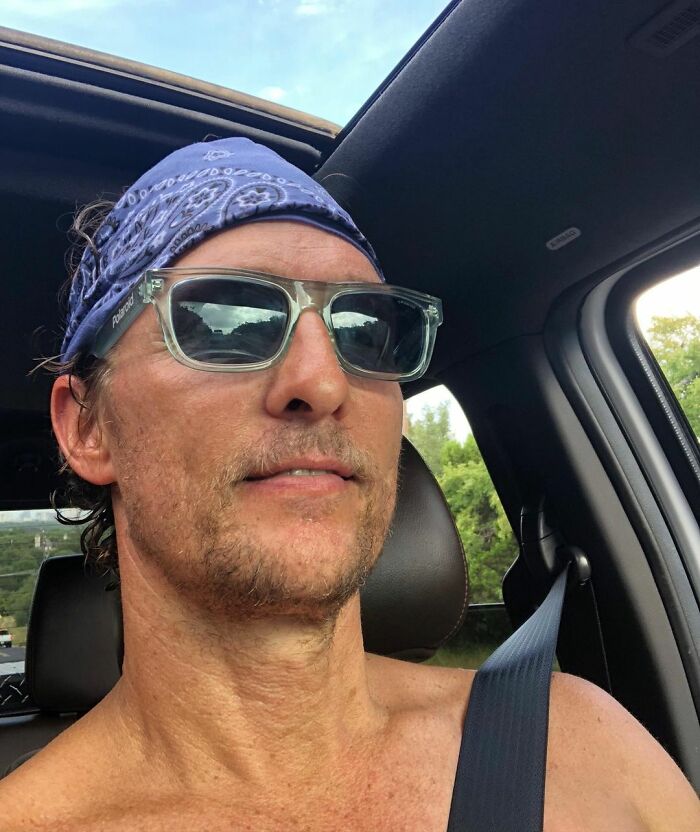 Actor wearing sunglasses and a bandana driving a car, representing actors who revived their career with a single role.