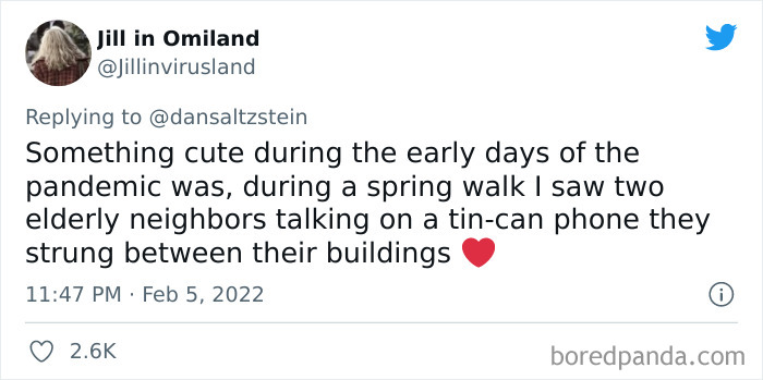 Tweet showing a wholesome New York experience during the pandemic with elderly neighbors chatting on a tin-can phone.