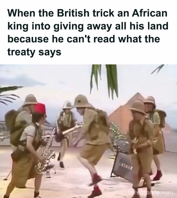Group of people in colonial explorer outfits playing musical instruments near pyramids, illustrating history memes humor.