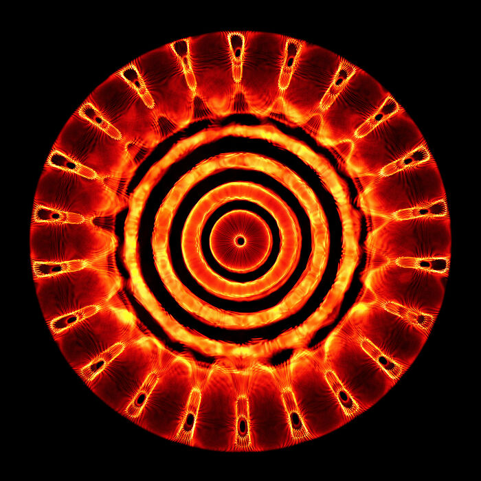 Abstract circular pattern with glowing orange and red rings, featured in Budapest International Photo Awards winners 2021.