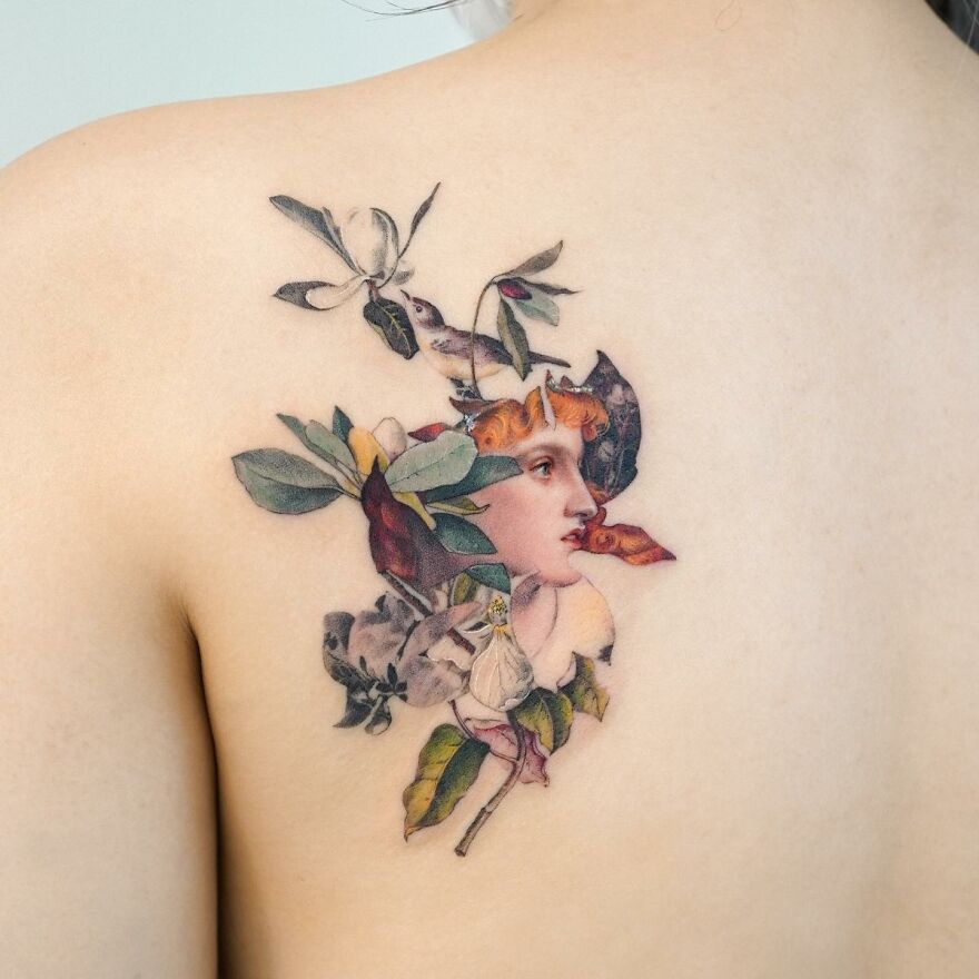 Painting-like tattoo on shoulder with floral and portrait details.