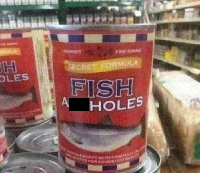 Canned fish labeled with a humorous and unusual name in a grocery store aisle.