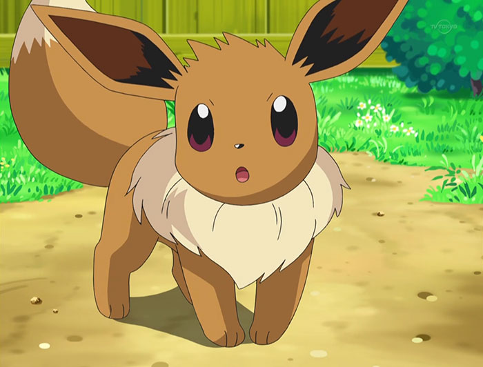 Cute animated character Eevee standing on a sunny patch of grass.