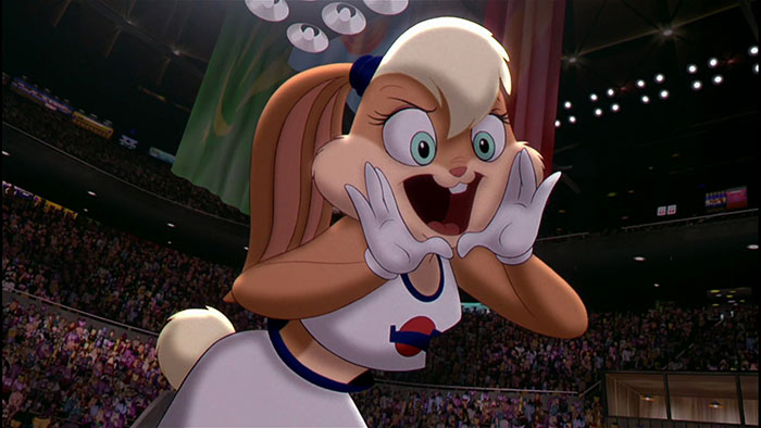Cute animated character cheering in a sports arena, wearing a white basketball outfit with a cheering crowd in the background.