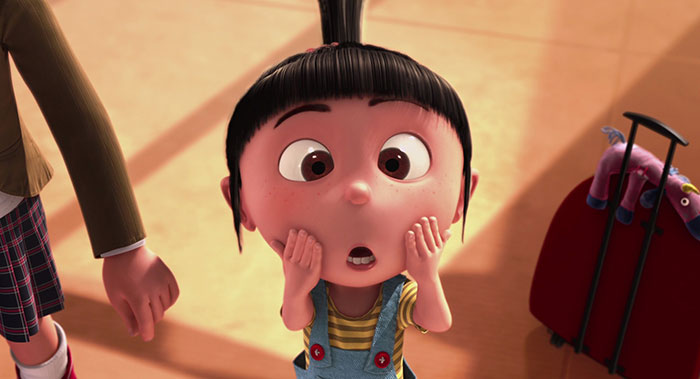 Cute animated character with big eyes and a surprised expression, standing near a red suitcase.