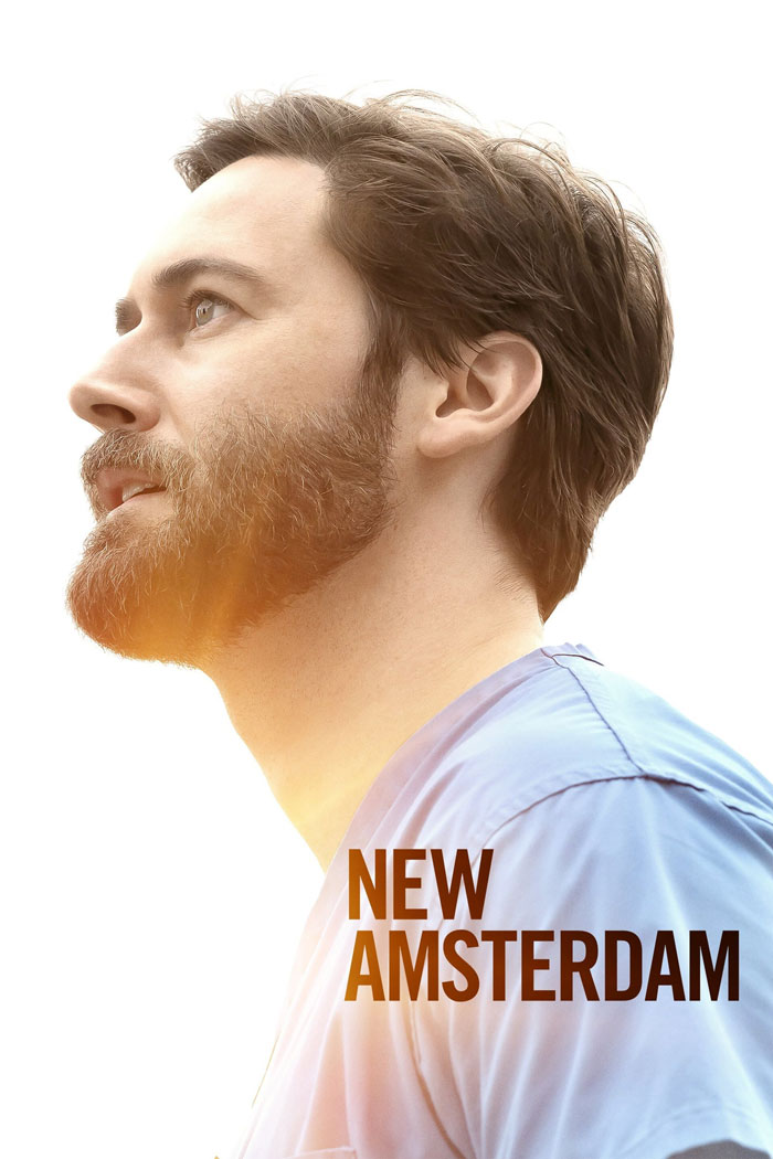 Profile of a male doctor in scrubs from the TV show "New Amsterdam," captured against a bright background.