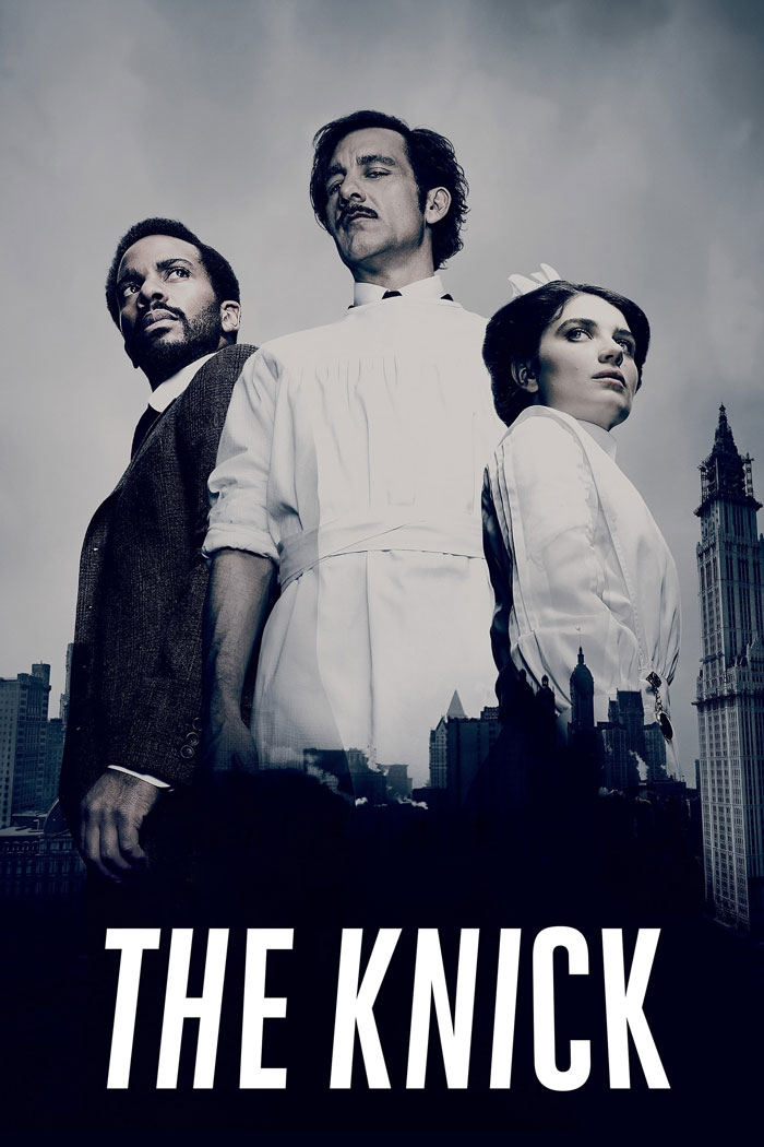 Cast of the medical show "The Knick" in period costumes with a city skyline background.