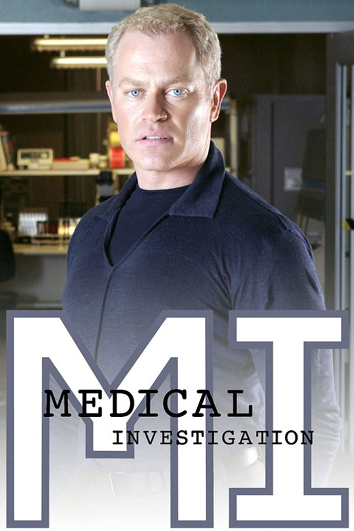 Actor in a dark shirt standing in a medical lab, promoting a TV show about medical workers.