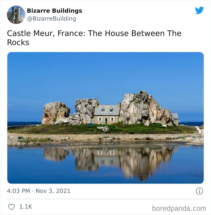 Unique and cool architectural house built between large rocks in France, showcasing unusual and uncomfortable building design.