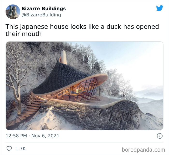 Unique and cool architectural building in snowy landscape with an unusual shape resembling an open duck's mouth.