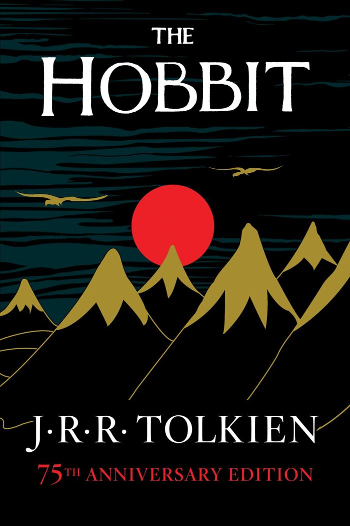 The Hobbit book cover with mountains and a red sun, featured in folks online list of books that blew their minds.