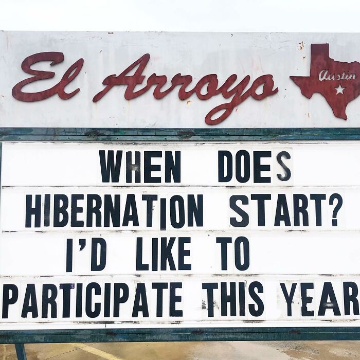 Restaurant sign with a humorous message about wanting to hibernate this year.