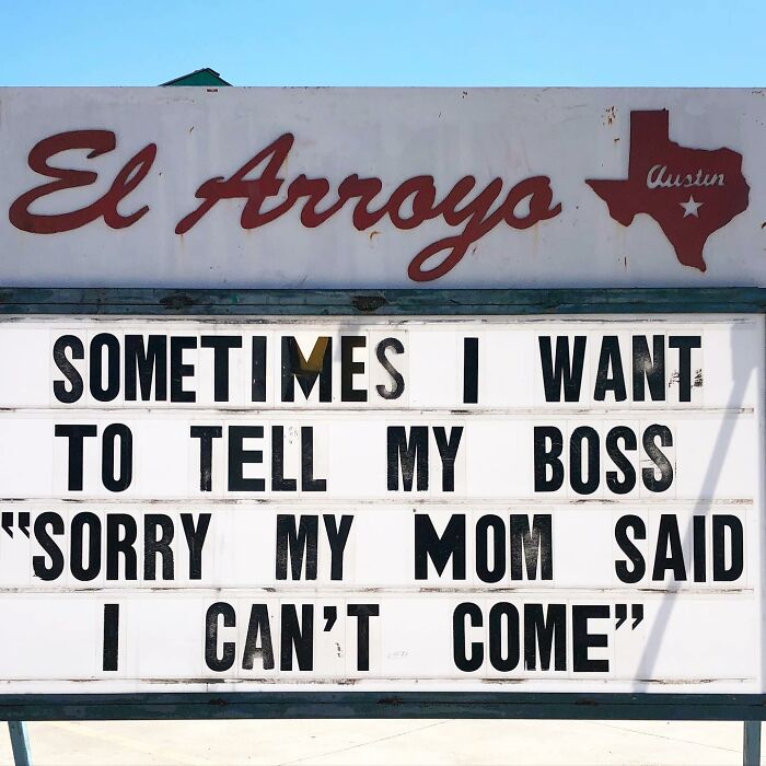 Restaurant sign with a humorous message about telling a boss, "Sorry my mom said I can't come."