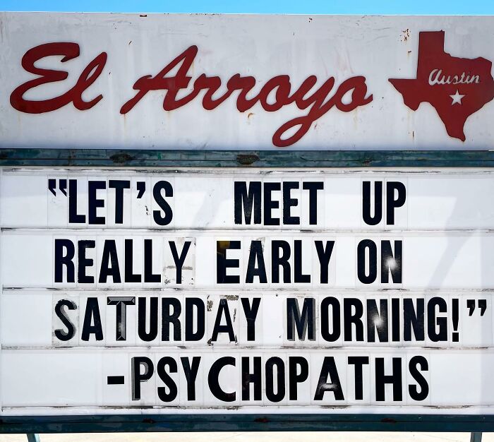 Restaurant sign with humorous message about meeting early on Saturday.