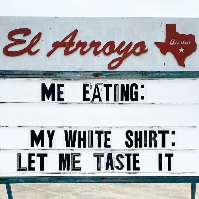 Restaurant sign with funny message about eating and a white shirt.