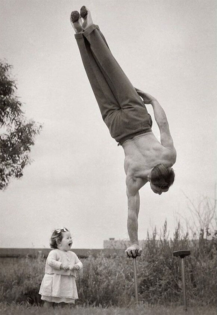 Dad Showing Off His Skill To The Surprise Of His Little Daughter In Melbourne, Australia, 1940s