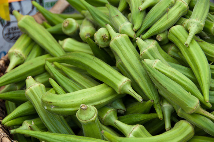 Close-up of fresh green okra, one of the most inedible foods according to adventurous food eaters worldwide.