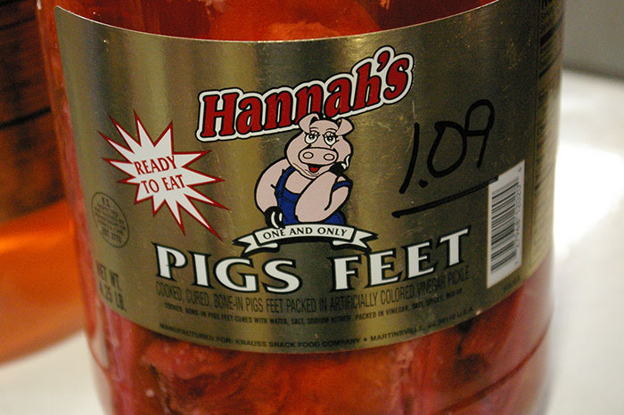 Jar of Hannah's pigs feet labeled as ready to eat, representing one of the most inedible foods according to adventurous eaters.
