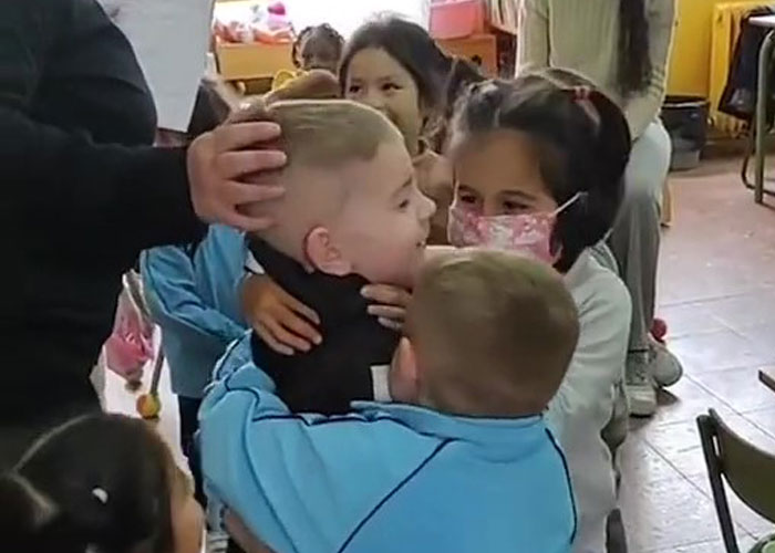 In A Heartwarming Moment, Ukrainian Boy Is Hugged By New Spanish Classmates On His First Day Of School