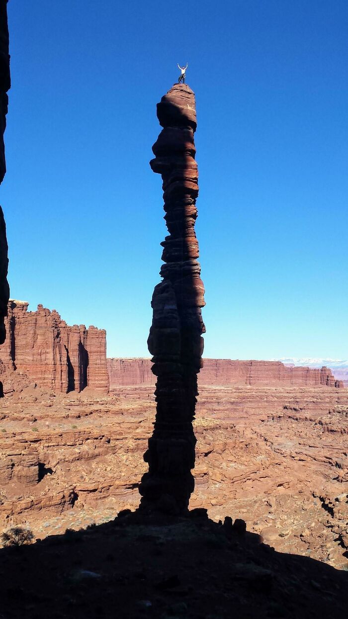 Standing On The Summit Of The Pixie Stick In Canyonlands National Park, Utah