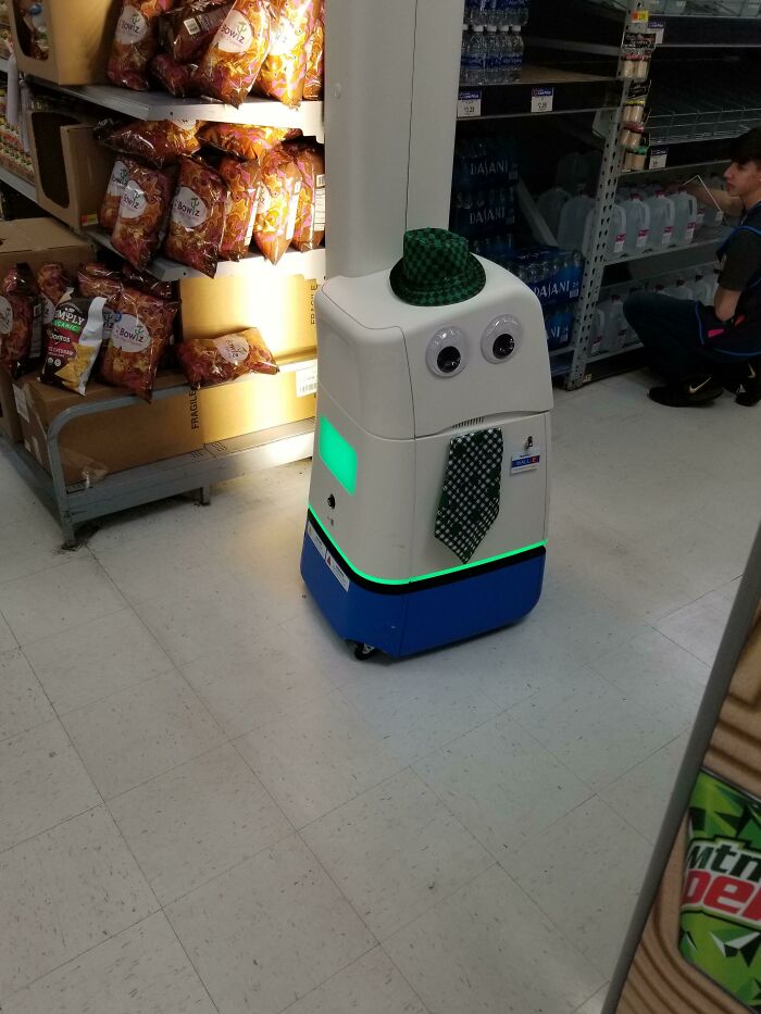 Cleaning robot with hat eyes and a tie 