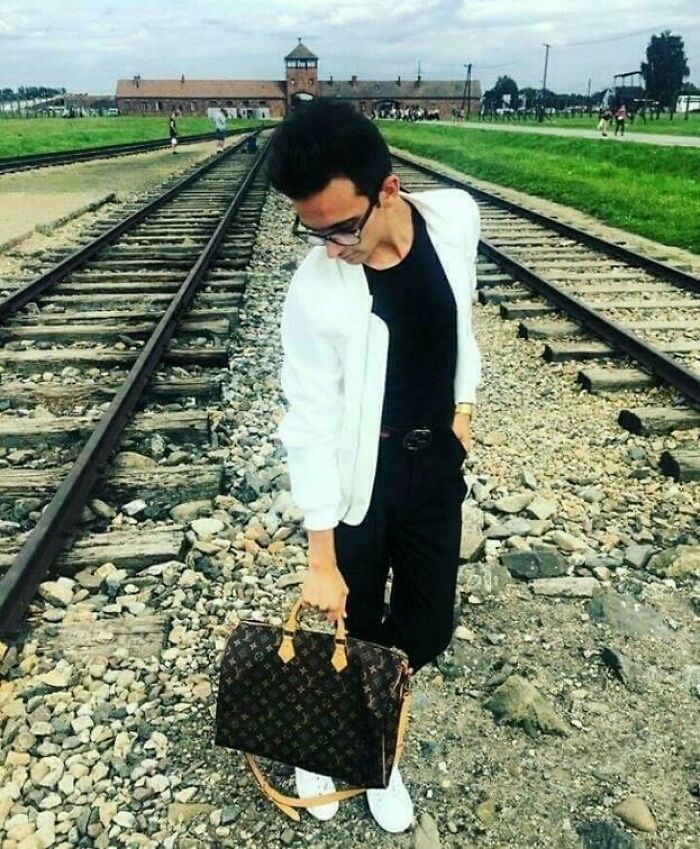 Flexing Your Louis Vuitton Bag On The Rails That Transported Countless Jews To Their Death