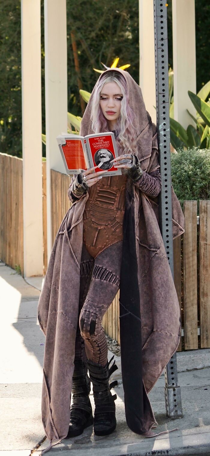 Grimes Seen Reading Karl Marx Following Split With World’s Richest Man Elon Musk