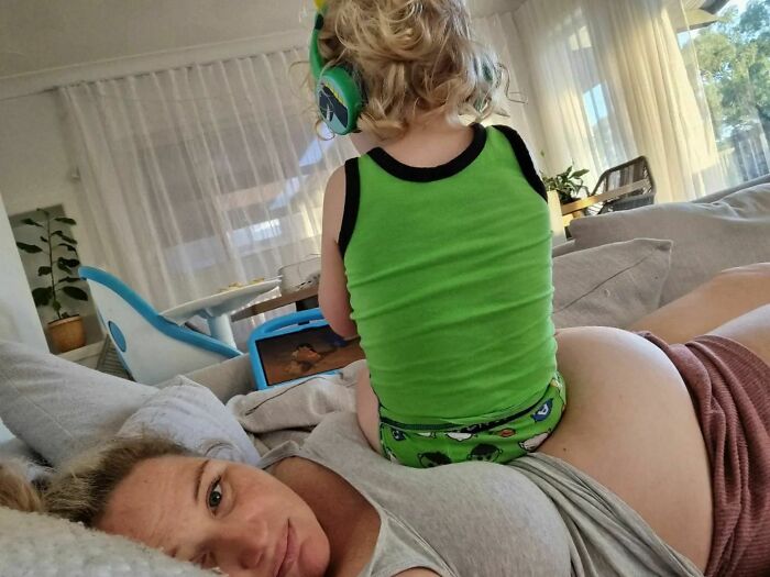 The Reality Of Pregnancy With A Toddler. He Has The Whole Lounge, And Chooses To Sit Here