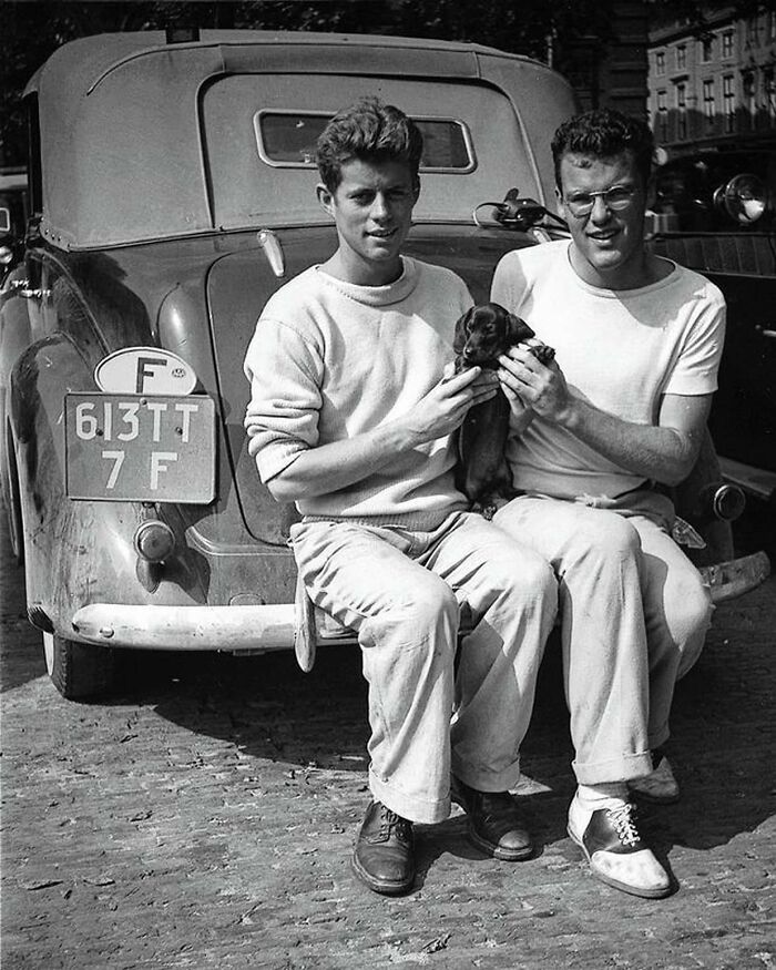 A Young John F. Kennedy And His Gay Friend Lem Billings Posing With Their Little Companion Dunker During Their Stay In The Hague, The Netherlands In 1937