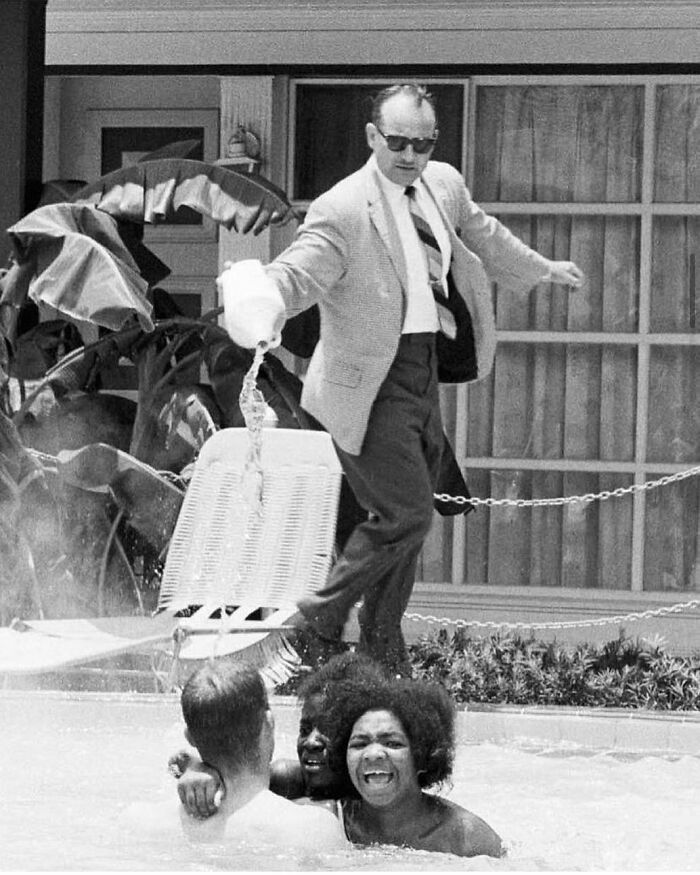 Protestors Scream As The Hotel Owner Pours Acid Into The ‘Whites-Only’ Pool