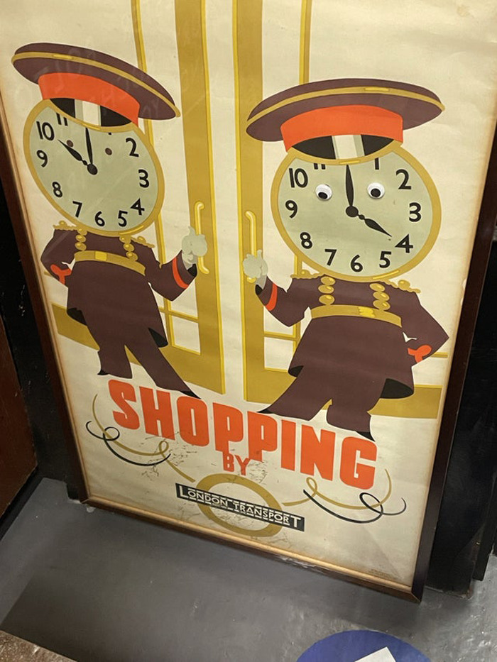 Vintage London Transport poster with clocks as faces featuring wiggle eyes for a humorous eyebombing effect.