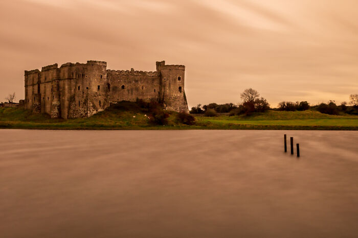Carw Castle, West Wales, UK At Sunset