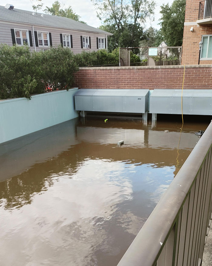This Flooded Parking Garage, Containing Roughly 150 Cars