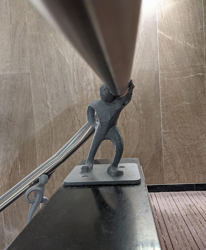 The Banisters At My Hotel Were Held Up By Little Metal Men