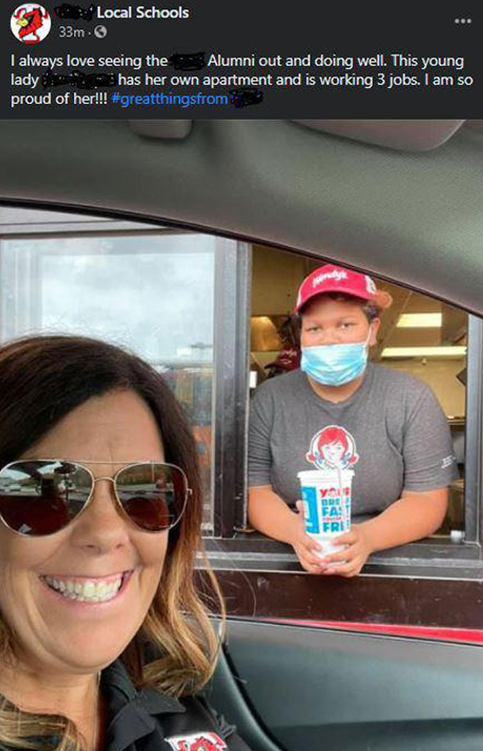 School Superintendent Showing Off An Alumni