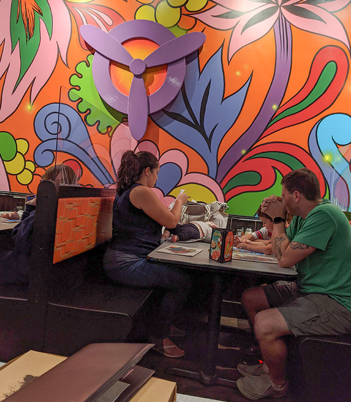 Changing A Babies Diaper On A Restaurant Table