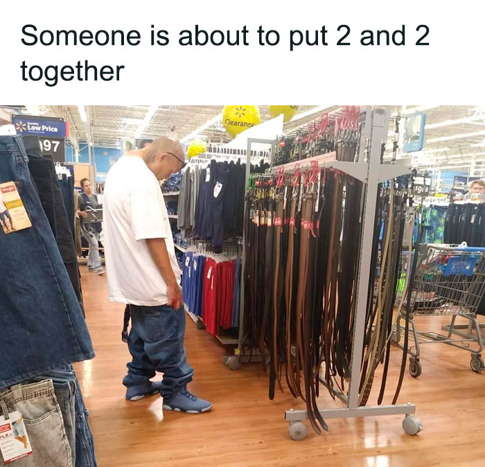 Person with saggy pants looking for a belt 