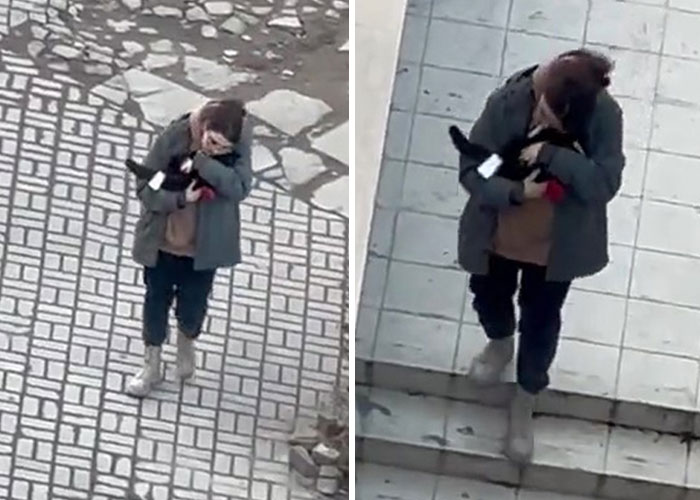 Esta mujer carga con su gato mientras lo consuela ante el sonido de las alarmas de ataque aéreo en Kyiv, Ucrania