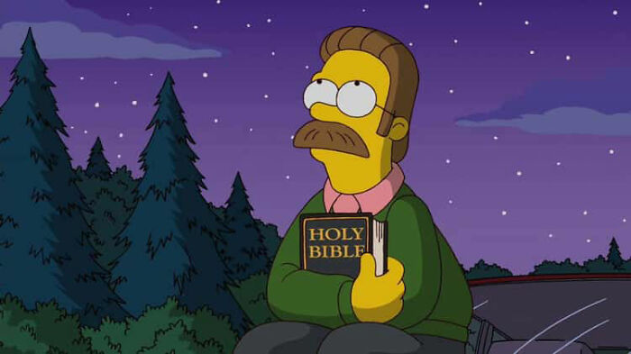 Character from The Simpsons holding a Bible at night, illustrating fans noticing small details and theories about Homer.
