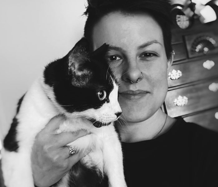 Delivery Driver Leaves Car For A Second, Comes Back To Find A Cat In The Passenger Seat