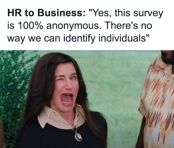 Woman winking humorously under office life meme text about anonymous surveys, embodying corporate humor.